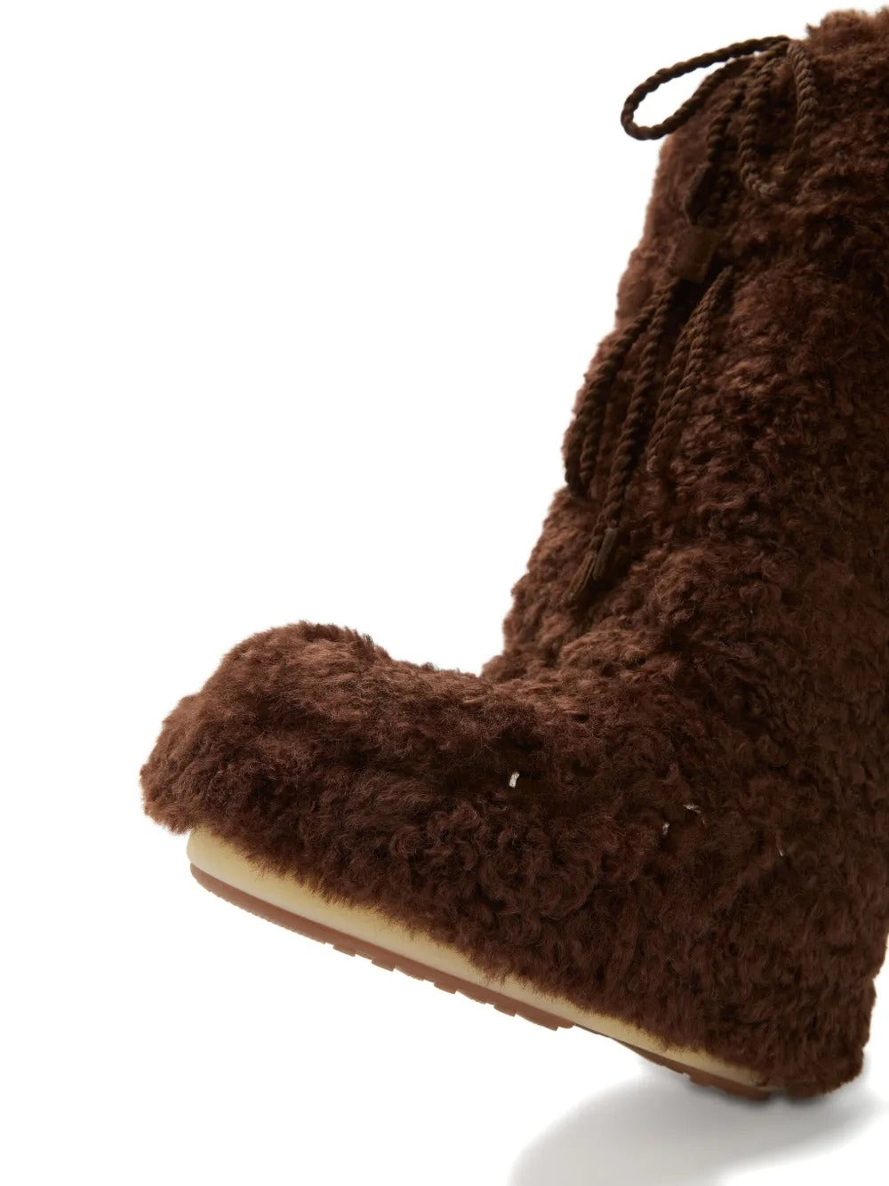 Close up of brown boots, showing texture of the polyester fabric