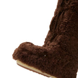 Close up of brown boots, showing texture of the polyester fabric