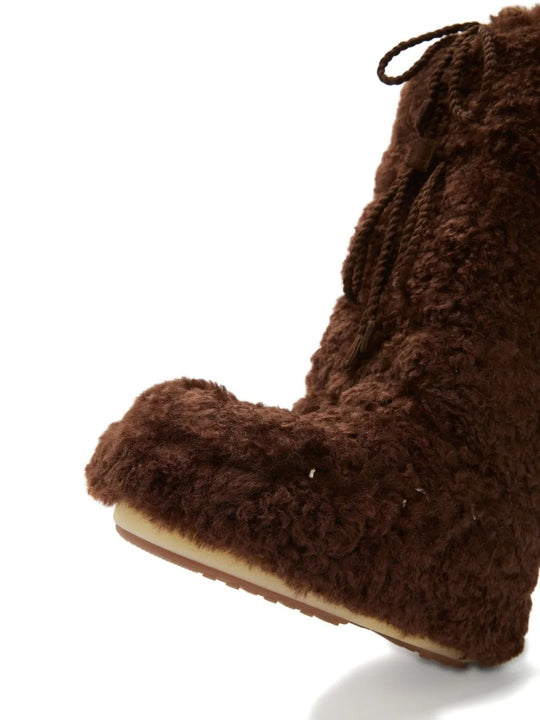 Close up of brown boots, showing texture of the polyester fabric