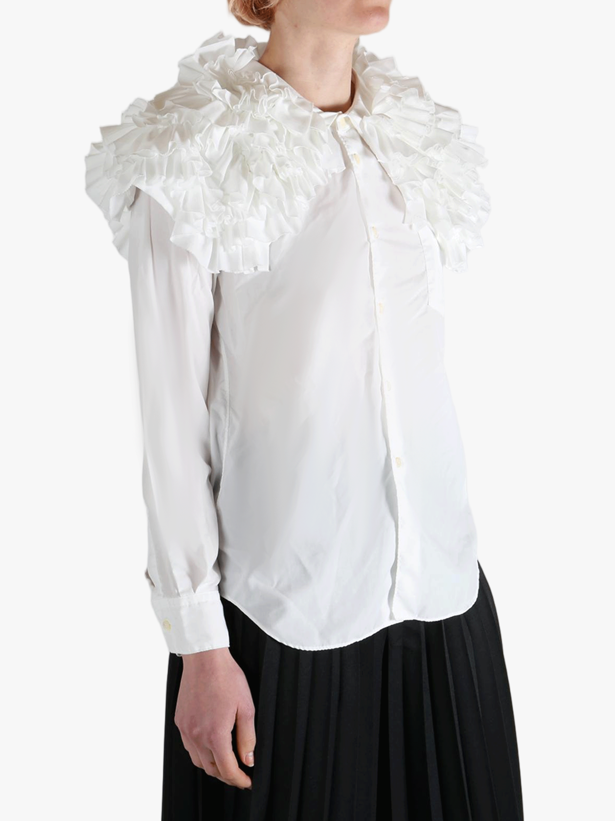 White shirt worn by a person, showing the shirt's fit