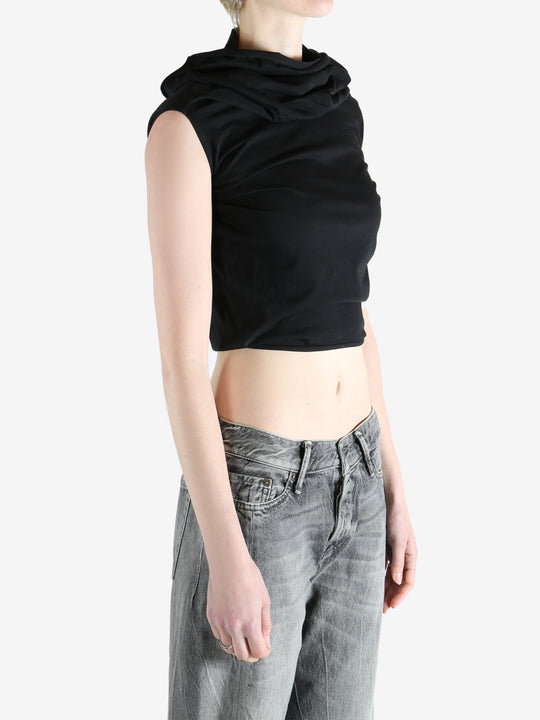 black sleeveless top worn by a person, showing the top fit