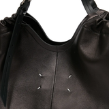 Close up of black bag,showing texture of the leather fabric