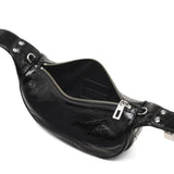 Close up of black bags, showing texture of the leather fabric