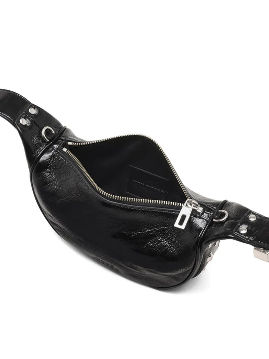 Close up of black bags, showing texture of the leather fabric