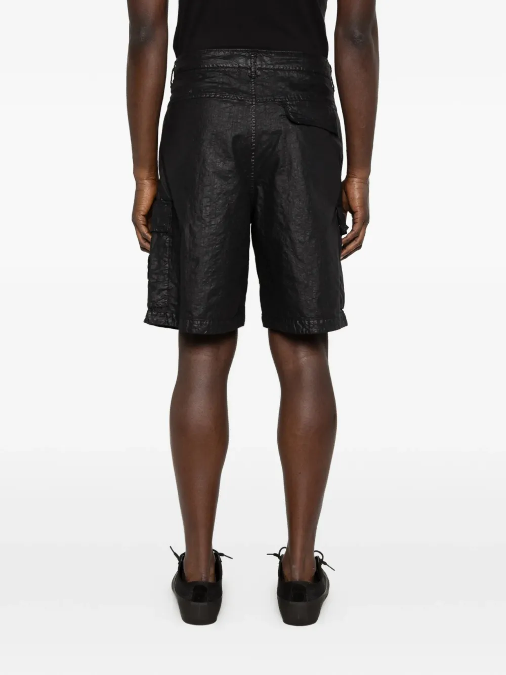 Black shorts worn by a person, showing the black shorts' fit