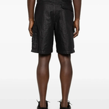 Black shorts worn by a person, showing the black shorts' fit