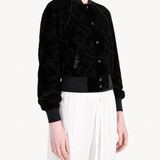 Black jacket worn by a person, showing the jacket fit
