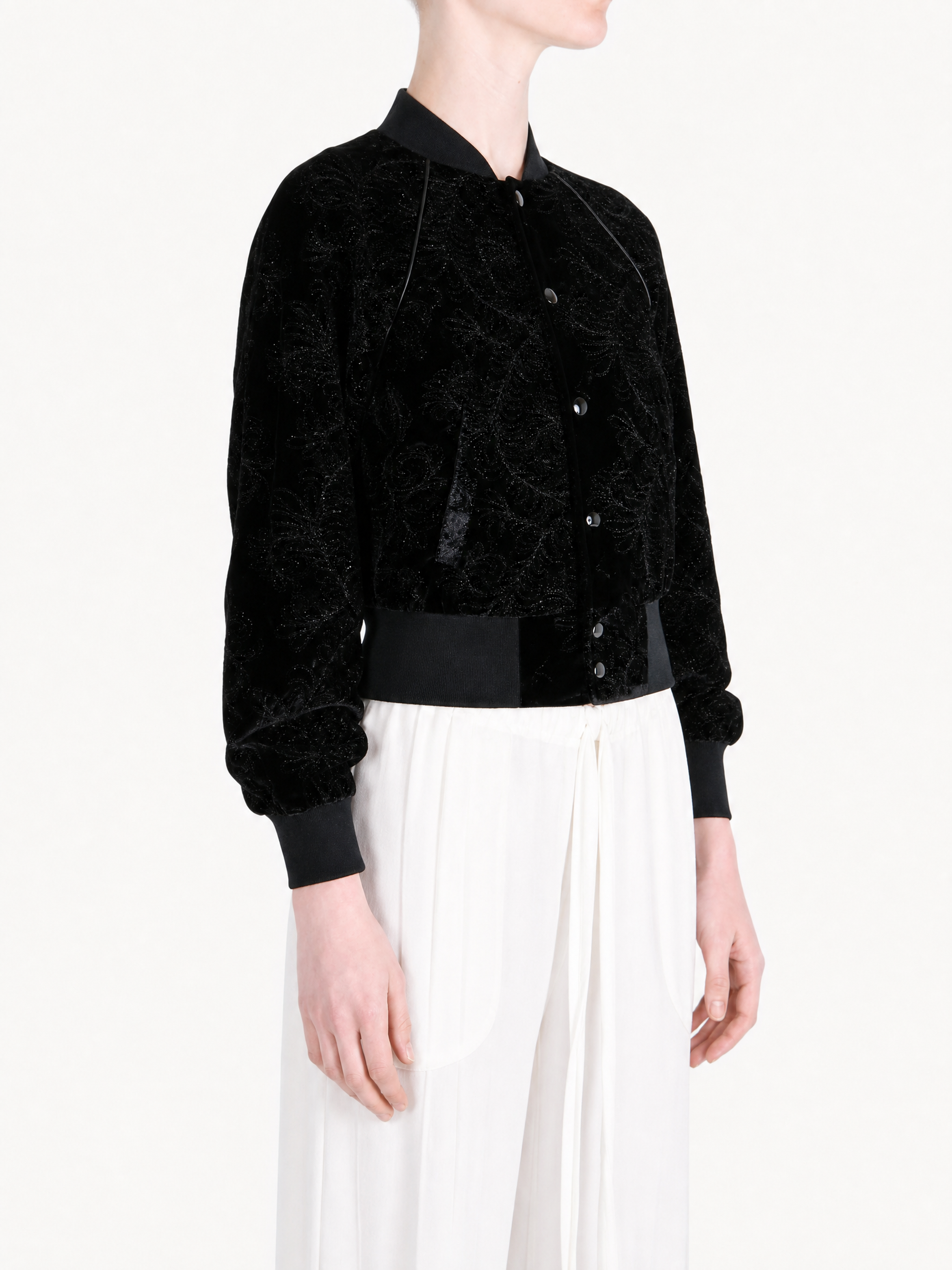 Black jacket worn by a person, showing the jacket fit