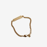 Close up of yellow small accessories, showing texture of the brass fabric