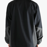 Black jacket worn by a person, showing the jacket's fit