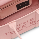 Close up of the pink bag, showing texture of the leather fabric