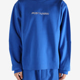 Blue sweatshirt worn by a person, showing the shirt's fit
