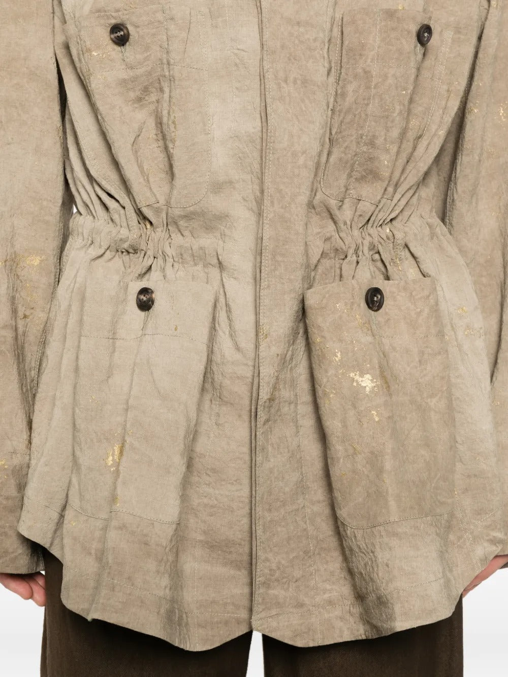 Tan jacket worn by a person, showing the jacket fit