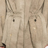 Tan jacket worn by a person, showing the jacket fit