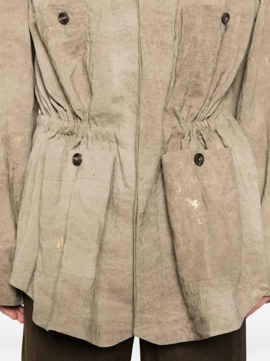Tan jacket worn by a person, showing the jacket fit
