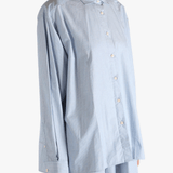 Blue shirt worn by a person, showing the shirt's fit