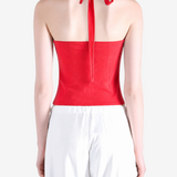 Red top worn by a person, showing the top fit