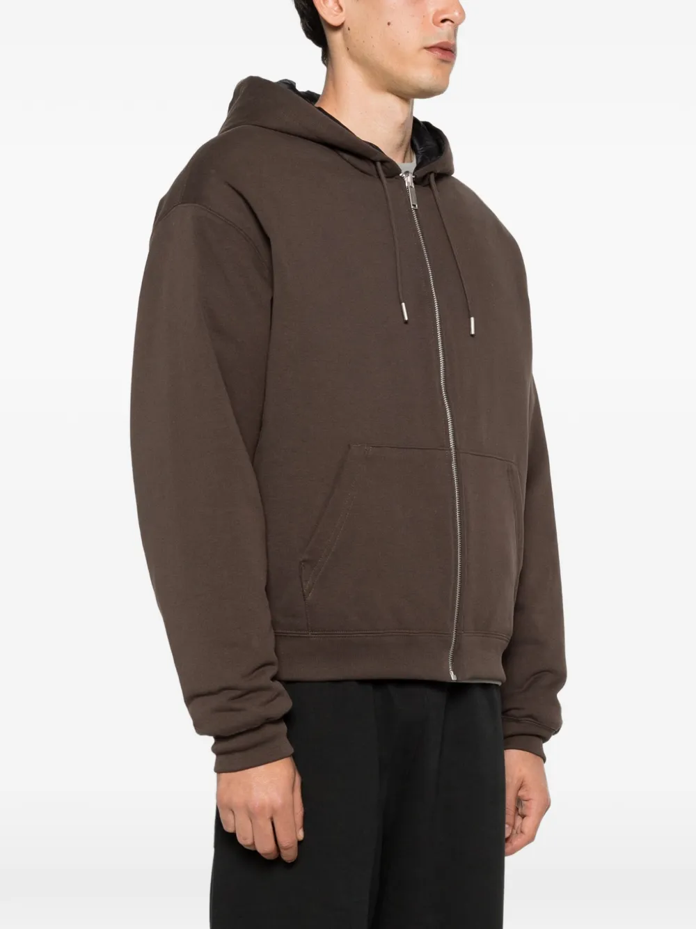 Brown jacket worn by a person, showing the jacket fit