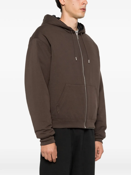 Brown jacket worn by a person, showing the jacket fit