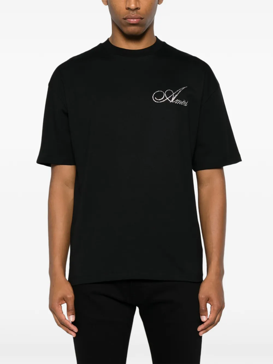  black t-shirt warn a person,showing the t-shirts fit