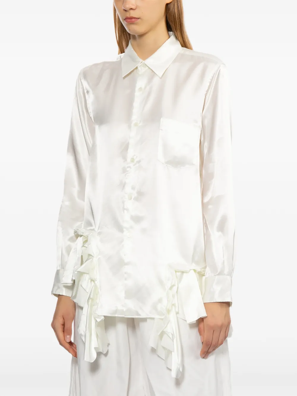 White shirt worn by a person, showing the shirt fit