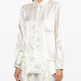 White shirt worn by a person, showing the shirt fit