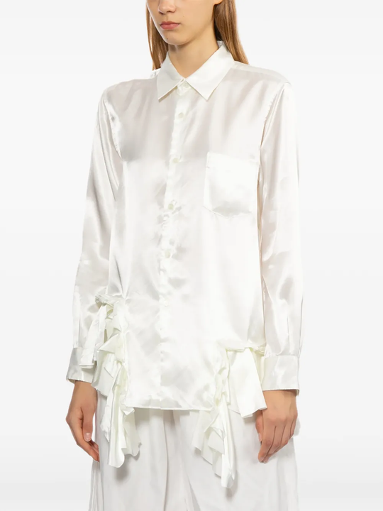 White shirt worn by a person, showing the shirt fit