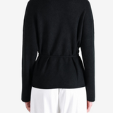 Black jacket worn by a person, showing the jacket fit