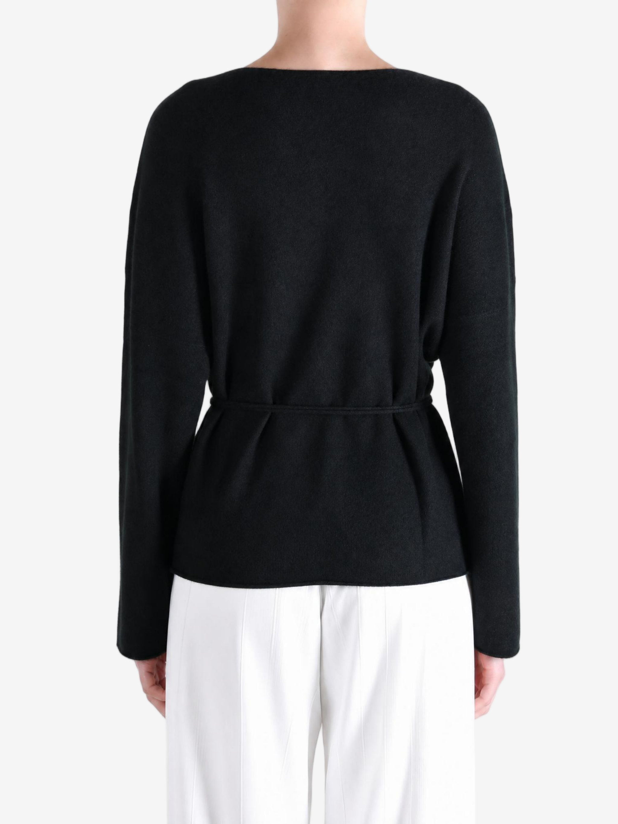 Black jacket worn by a person, showing the jacket fit