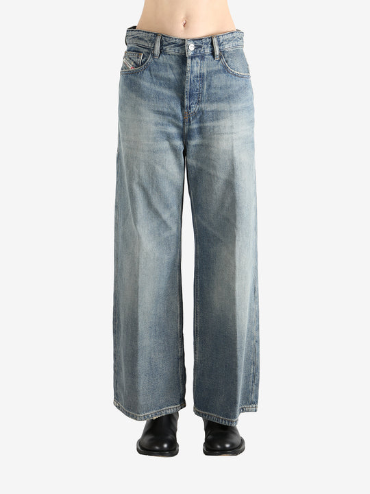 Blue jeans worn by a person, showing the jeans fit