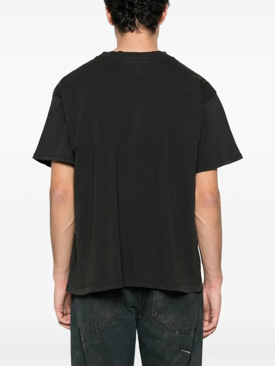 Black t-shirt worn by a person, showing the t-shirt's fit