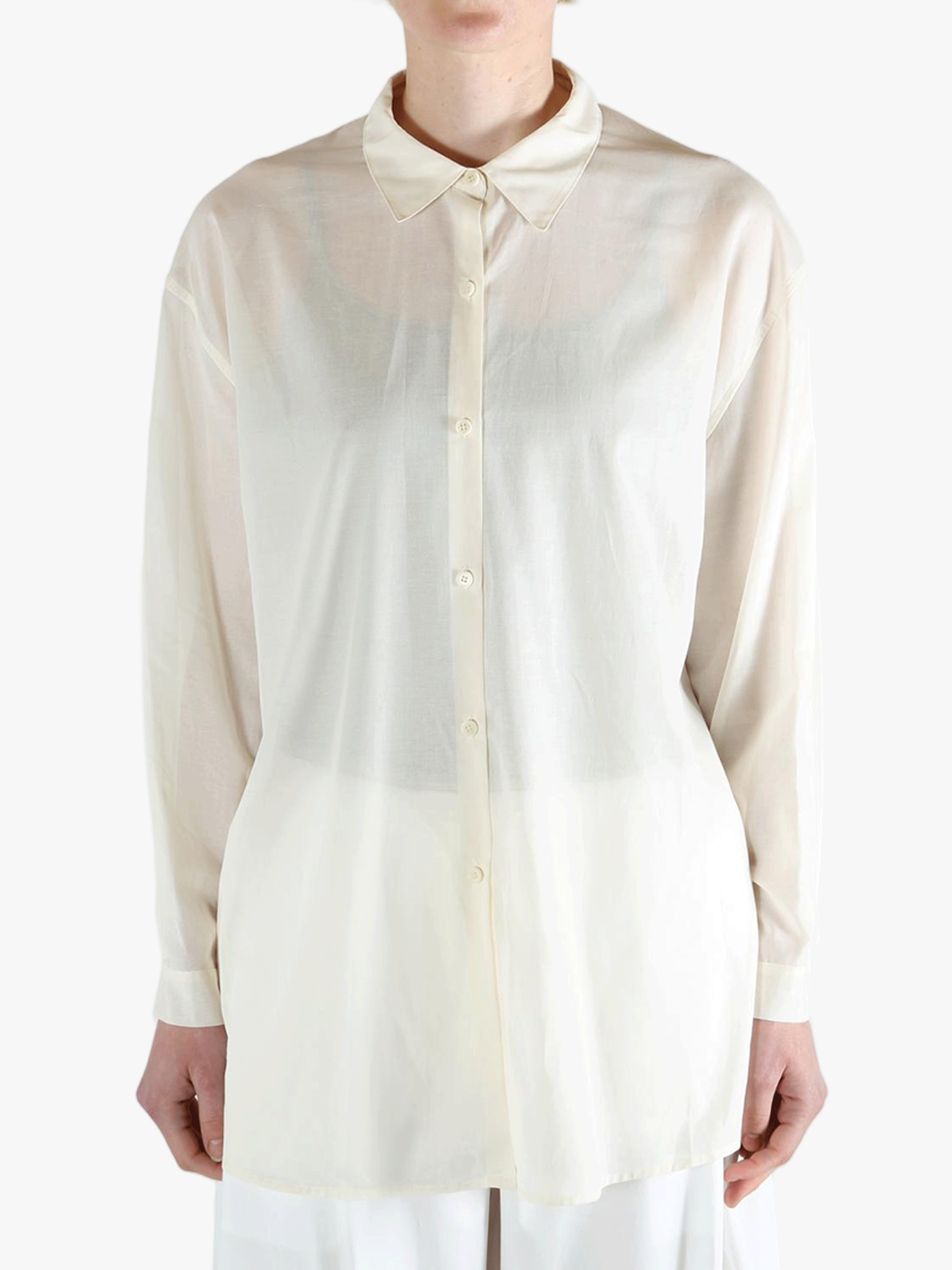 White shirt worn by a person, showing the shirt's fit