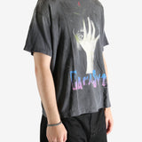 Black t-shirt worn by a person, showing the t-shirt's fit