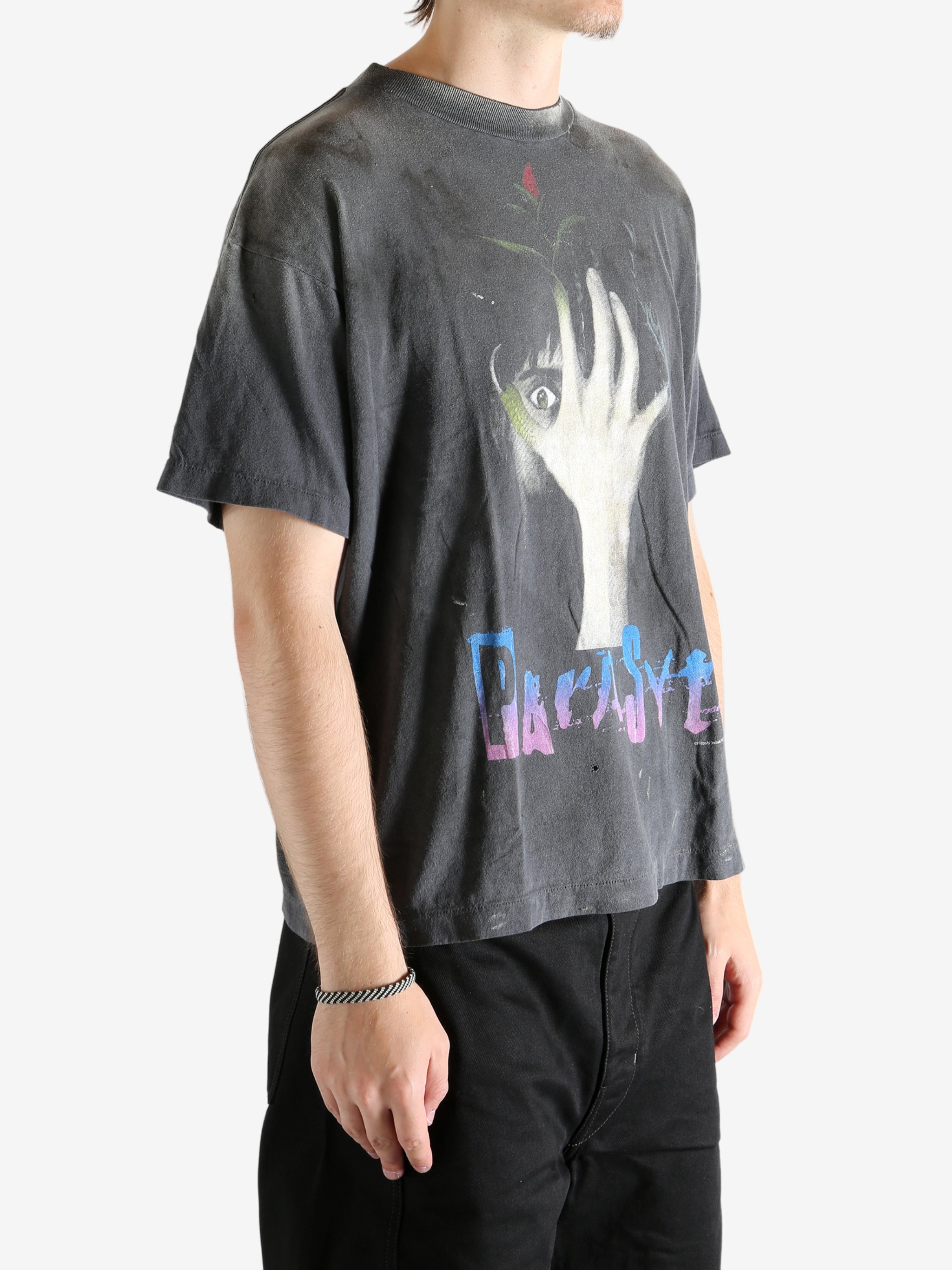 Black t-shirt worn by a person, showing the t-shirt's fit