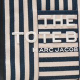 Close up of blue bag, showing texture of the cotton fabric