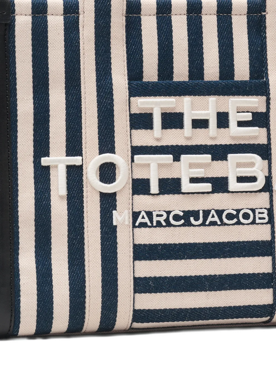 Close up of blue bag, showing texture of the cotton fabric