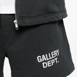 Close up of black shorts, showing texture of the cotton fabric