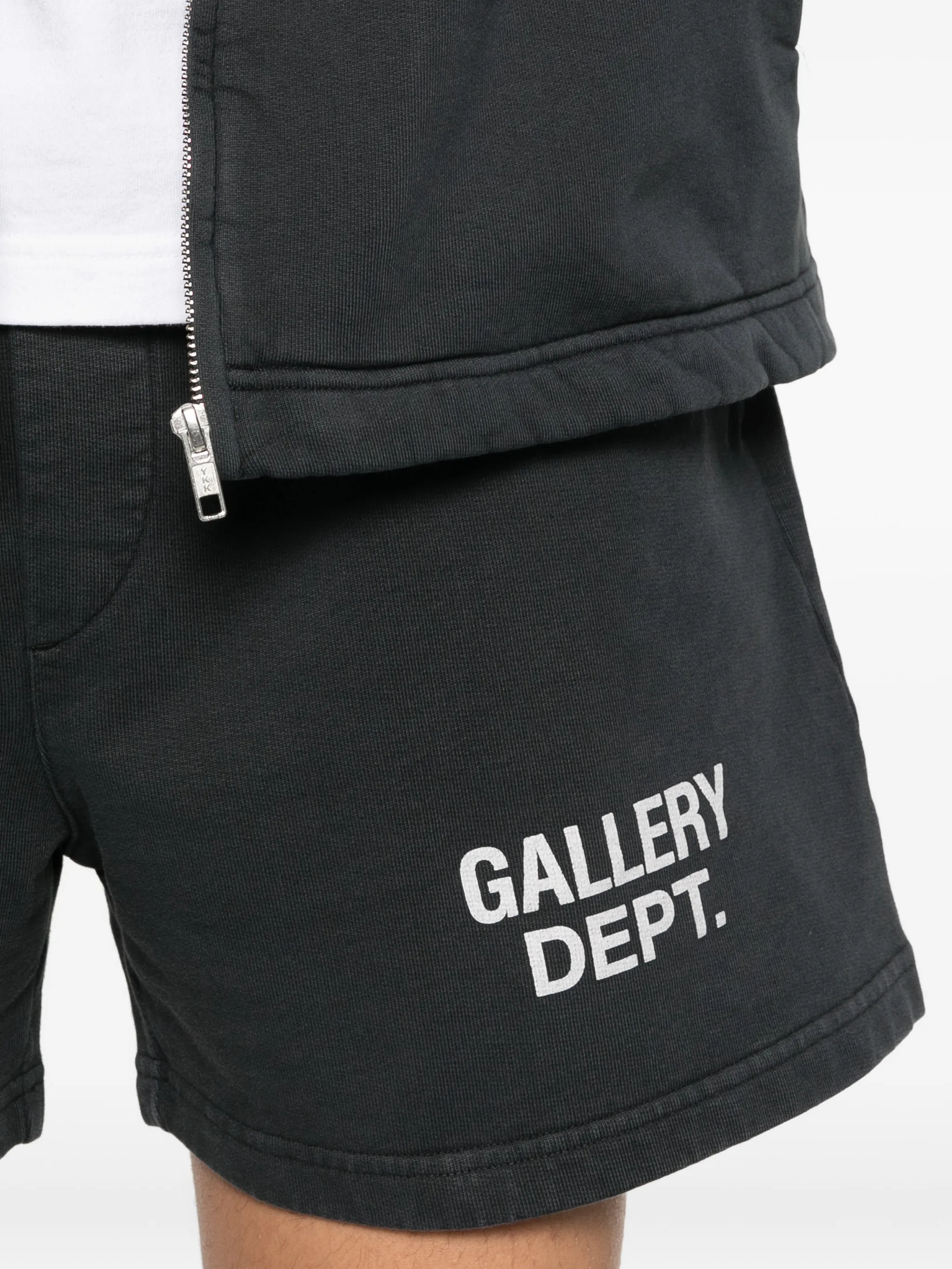 Close up of black shorts, showing texture of the cotton fabric