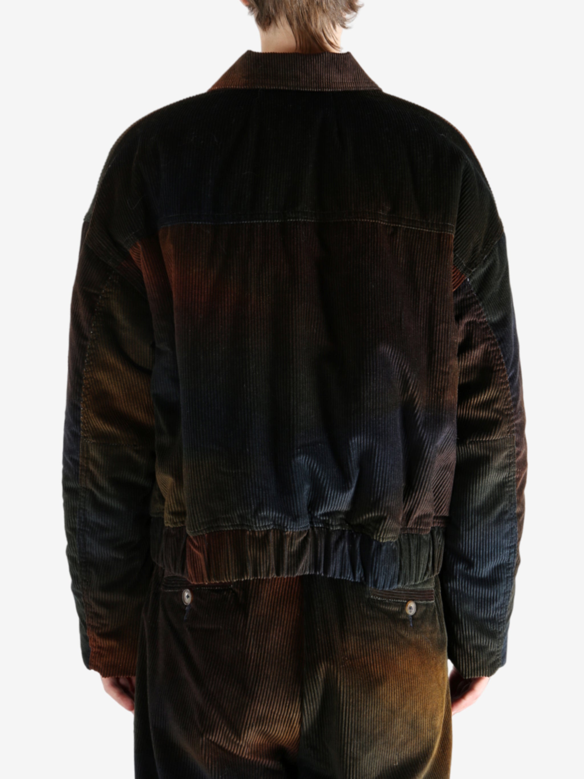 Black jacket worn by a person, showing the jacket's fit