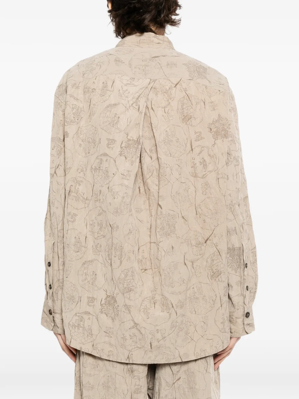 Tan shirt worn by a person, showing the shirt's fit