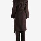 Brown coat worn by a person, showing the coat fit