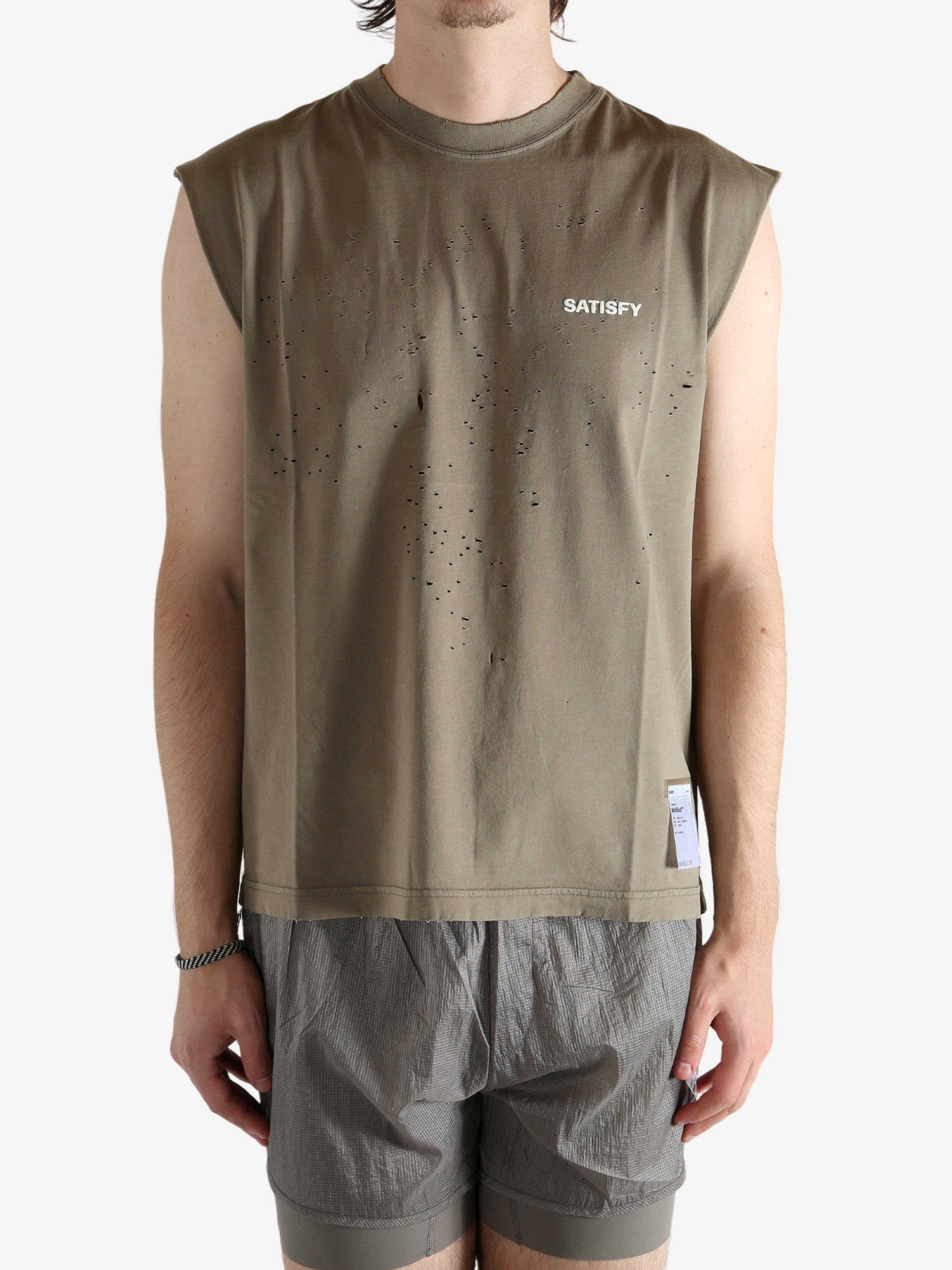 Brown shirt worn by a person, showing the shirt fit