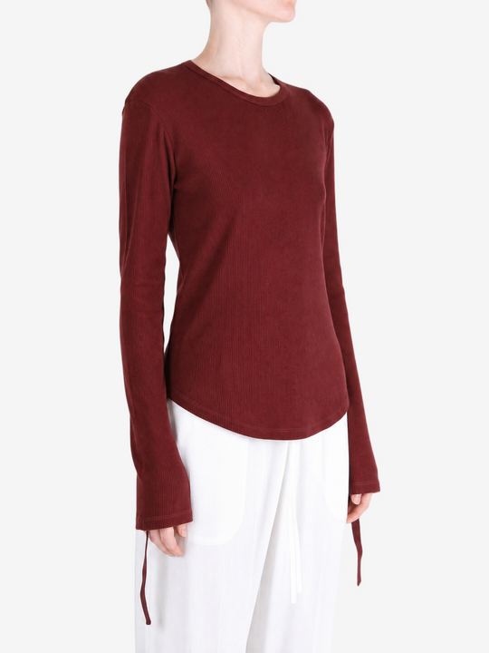 Burgundy top worn by a person, showing the top fit