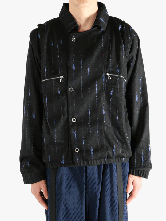 Black jacket worn by a person, showing the jacket's fit