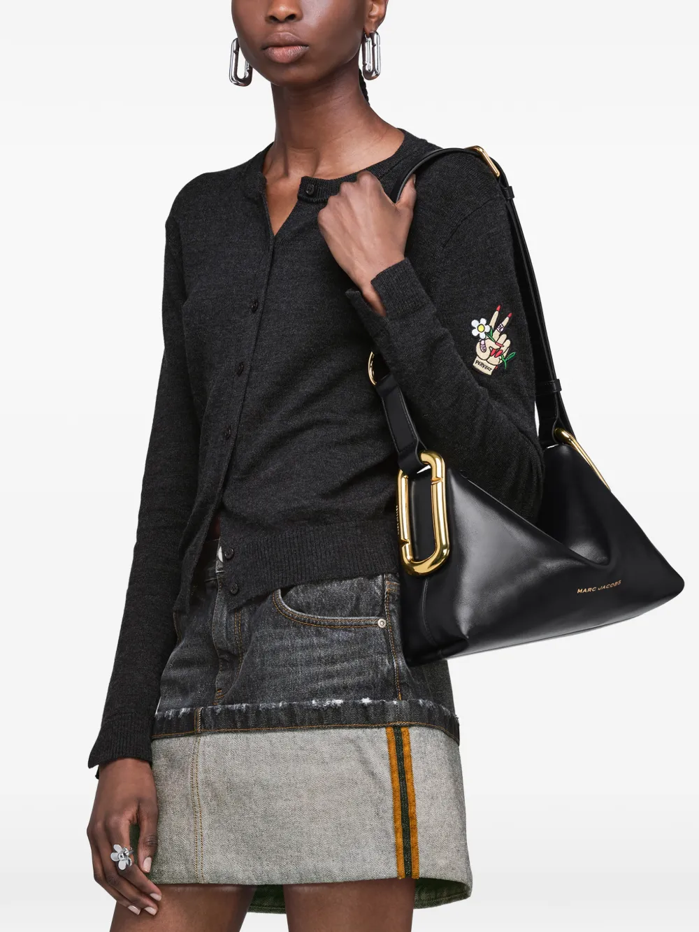Black bag worn by a person, showing the bag fit