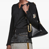 Black bag worn by a person, showing the bag fit