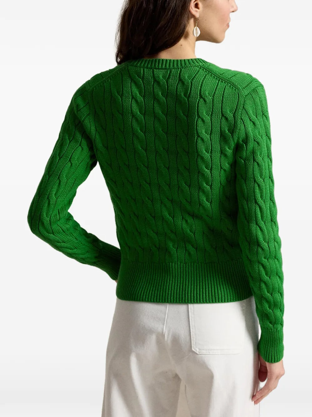 Green cardigan worn by a person, showing the cardigan's fit
