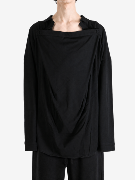 Black shirt worn by a person, showing the shirt fit