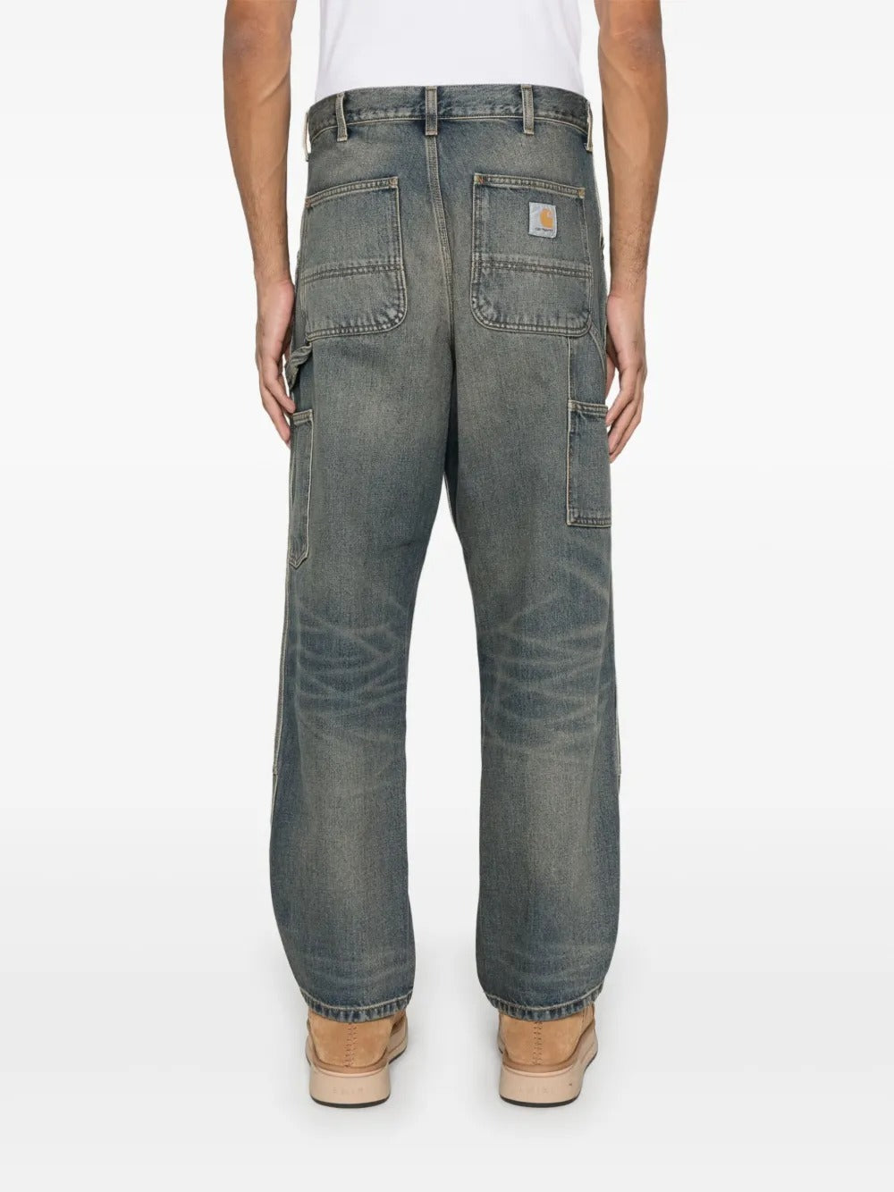 Blue jeans worn by a person, showing the jeans' fit