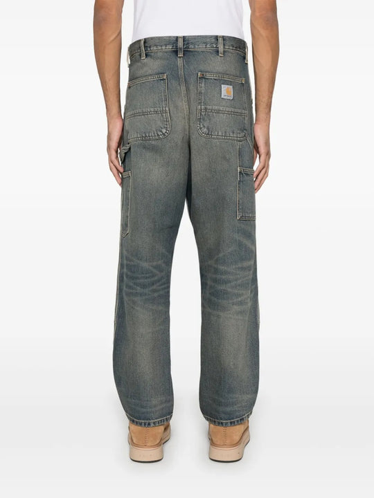 Blue jeans worn by a person, showing the jeans' fit